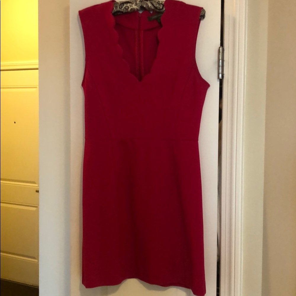 Pink dress with scalloped fabric touches!